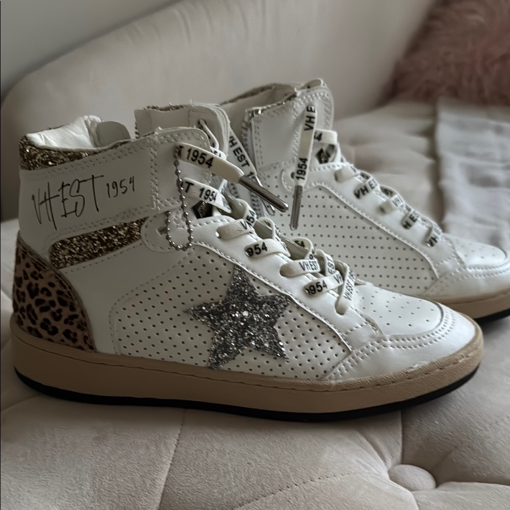 White and Brown High-Top Sneakers with Distinctive Design
